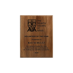A photo of a solid wood traditional Walnut plaque with a full laser engraving. 