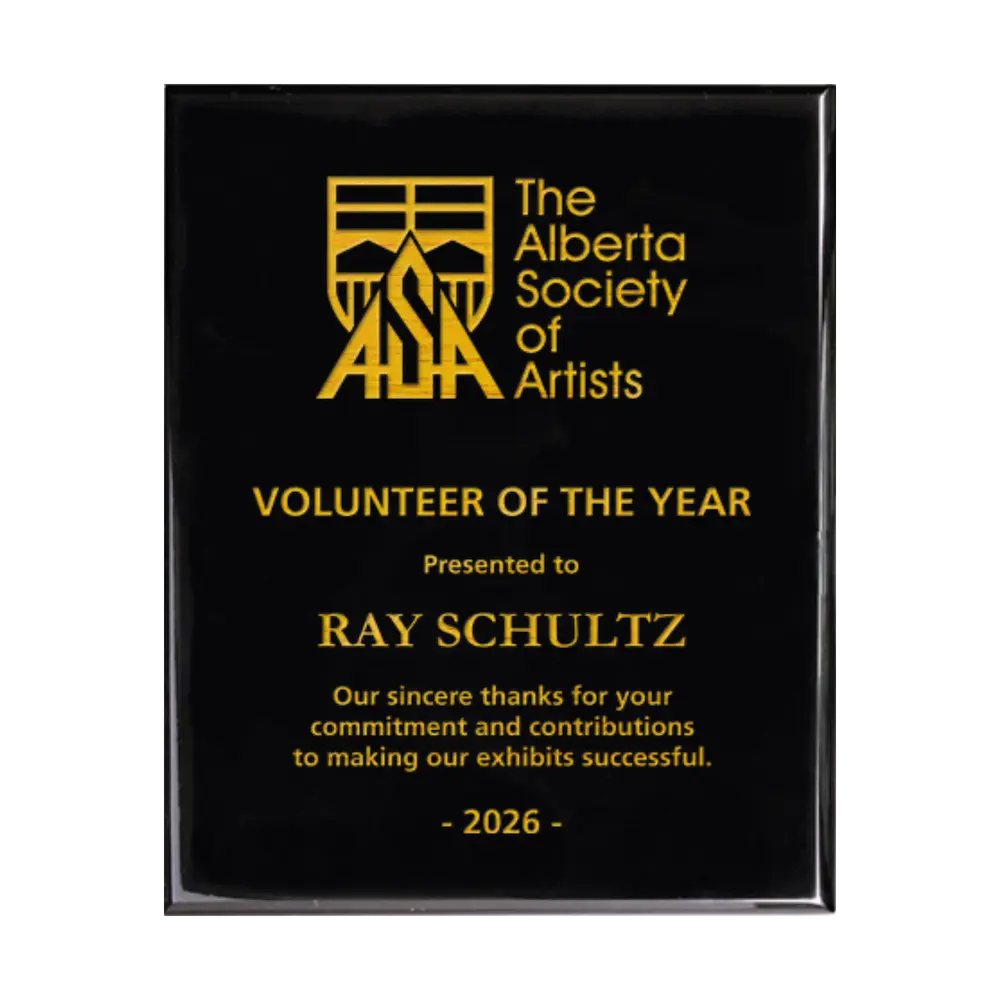 A photo of a Black Piano Finish plaque with full laser engraved text and graphics, and colour fill.