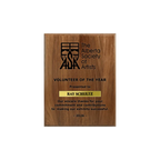 A photo of a solid wood traditional Walnut plaque with a laser engrave text and graphics, and a traditional engraved name plate.