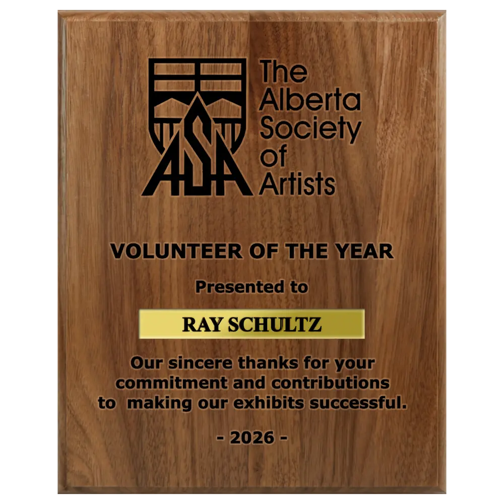 A photo of a solid wood traditional Walnut plaque with a laser engrave text and graphics, and a traditional engraved name plate.