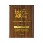 A photo of a Walnut Piano Finish plaque with a laser engrave text and graphics, and a traditional engraved name plate.