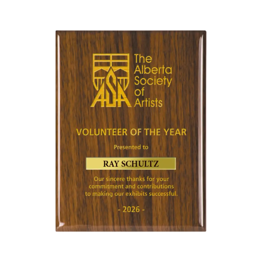 A photo of a Walnut Piano Finish plaque with a laser engrave text and graphics, and a traditional engraved name plate.