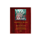 A photo of a Rosewood Piano Finish plaque with a full-coloured plate on the top-half and laser engraving on the bottom-half.