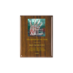 A photo of a Walnut Piano Finish plaque with a full-coloured plate on the top-half and laser engraving on the bottom-half.