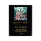 A photo of a Black Piano Finish plaque with a full-coloured plate on the top-half and laser engraving on the bottom-half.