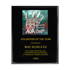 A photo of a Black Piano Finish plaque with a full-coloured plate on the top-half and laser engraving on the bottom-half.