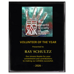 A photo of a Black Piano Finish plaque with a full-coloured plate on the top-half and laser engraving on the bottom-half.