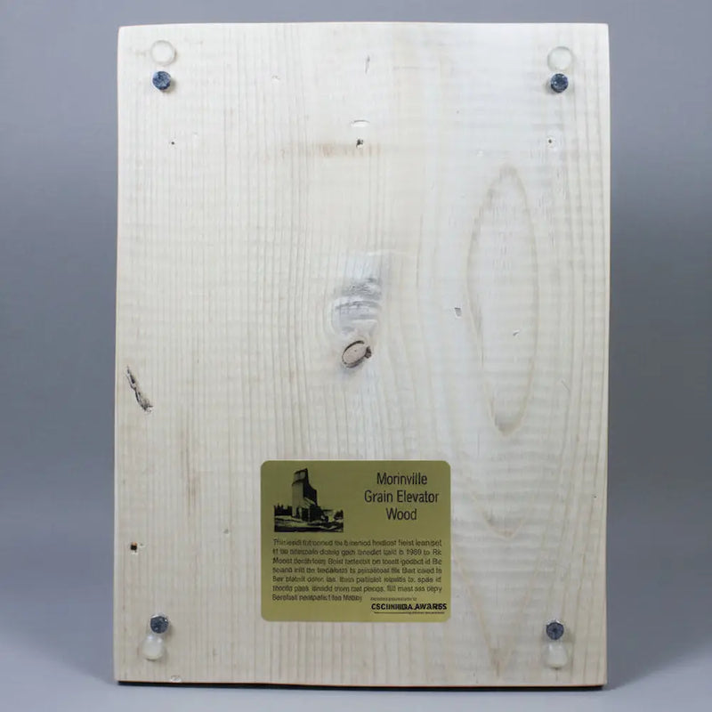 A back view photo of product 10-016B showing infographics of Morinville Grain Elevator Wood on gold plate.