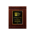 A photo of a solid wood Deep Groove Walnut plaque with a traditional engraved plate covering the plaque. 