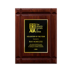 A photo of a solid wood Deep Groove Walnut plaque with a traditional engraved plate covering the plaque. 