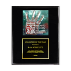 A photo of a Black Piano Finish plaque with a full-coloured plate on the top-half and traditional engraved plate on the bottom-half.