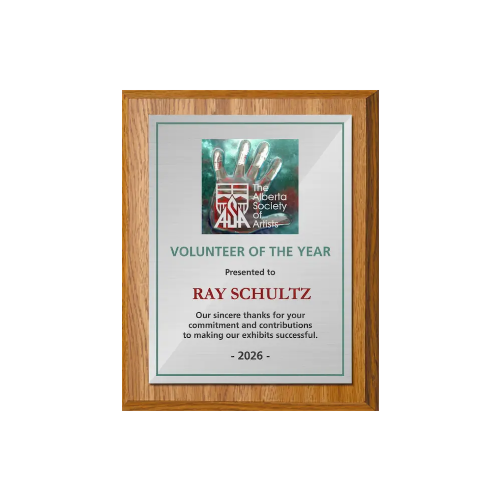 A photo of a Light Oak Laminate plaque with a full colour plate.