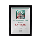 A photo of a Black Piano Finish plaque with a full colour plate.