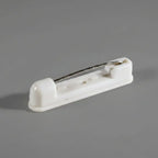 An image of a white pinback name badge accessory.