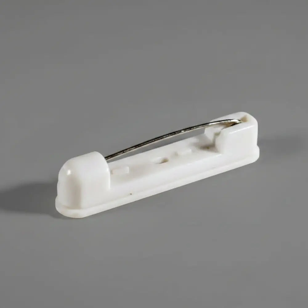 An image of a white pinback name badge accessory.