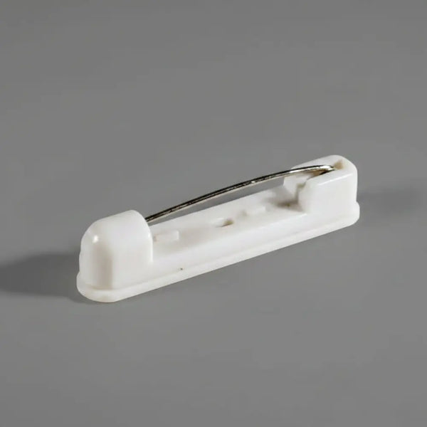 An image of a white pinback name badge accessory.