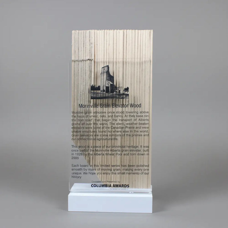 Morinville Grain Elevator wood cut into Alberta shaped placed on a metal base with clear acrylic front.