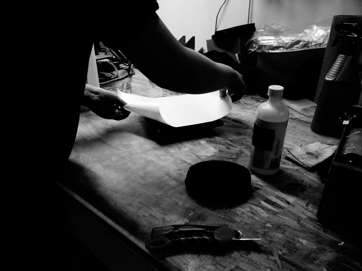 Dan Michael preparing the plaque to work on for a client